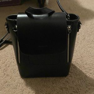 Madison west, black and silver backpack purse